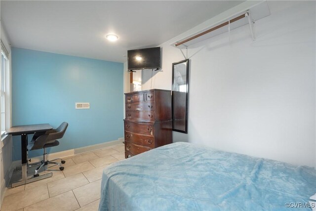 3057 Maury St, Richmond, VA 23224 - bedroom with baseboards and tile patterned flooring