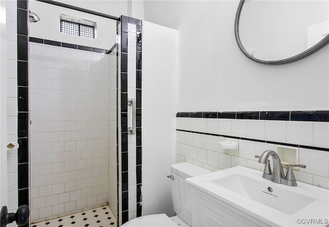 2407 Dumbarton Rd, Henrico, VA 23228 - bathroom featuring tiled shower, tile walls, and vanity