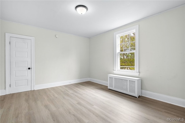 2407 Dumbarton Rd, Henrico, VA 23228 - unfurnished room with wood finished floors and radiator heating unit