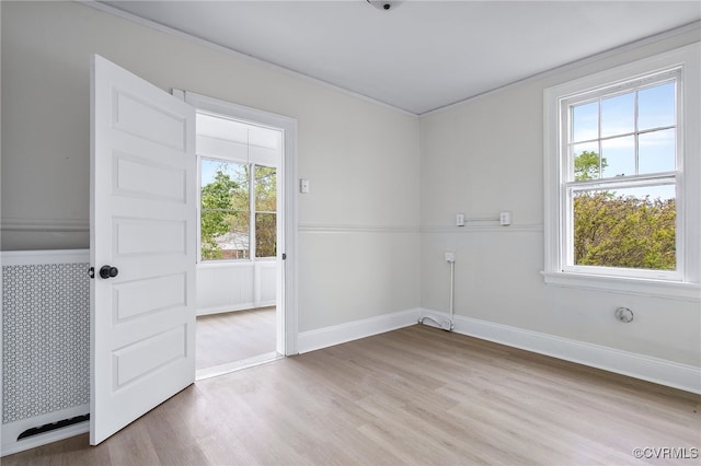 2407 Dumbarton Rd, Henrico, VA 23228 - spare room with healthy amount of natural light, light wood-style flooring, and crown molding