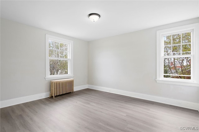2407 Dumbarton Rd, Henrico, VA 23228 - unfurnished room featuring radiator and wood finished floors