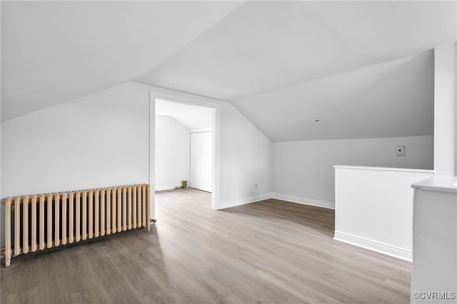 2407 Dumbarton Rd, Henrico, VA 23228 - bonus room with radiator, wood finished floors, and vaulted ceiling