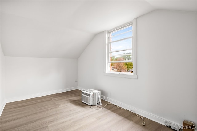 2407 Dumbarton Rd, Henrico, VA 23228 - additional living space featuring vaulted ceiling, wood finished floors, and an AC wall unit