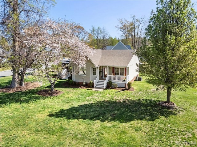 view of front of home with a front yard and covered porch