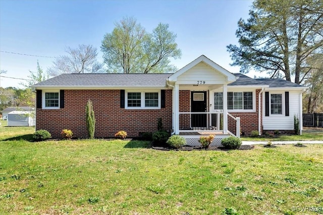 single story home featuring a front lawn and brick siding