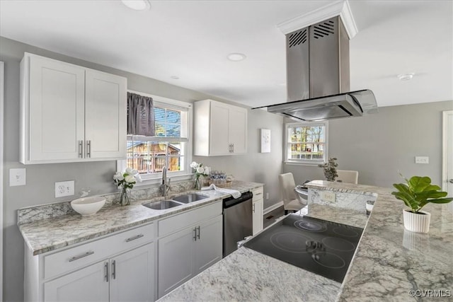 kitchen featuring a sink, white cabinetry, a wealth of natural light, and island range hood