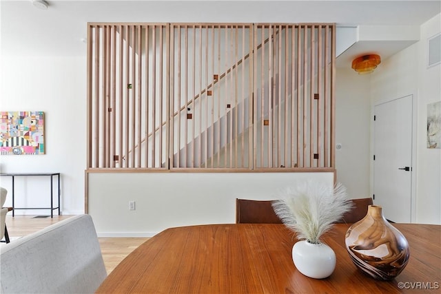 dining area with wood finished floors