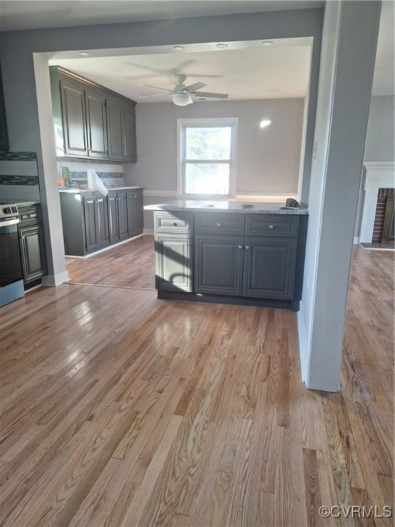 410 N Daisy Ave, Henrico, VA 23075 - kitchen featuring ceiling fan, light wood-type flooring, and light countertops