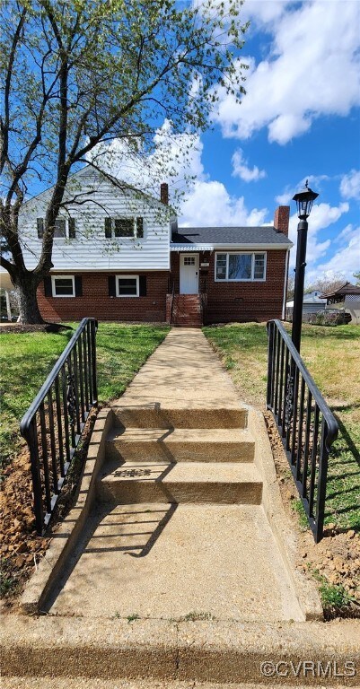 410 N Daisy Ave, Henrico, VA 23075 - view of front of house featuring a chimney, brick siding, and a front lawn