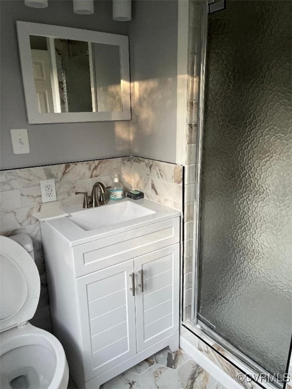 410 N Daisy Ave, Henrico, VA 23075 - bathroom featuring a stall shower, marble look tile flooring, toilet, and vanity