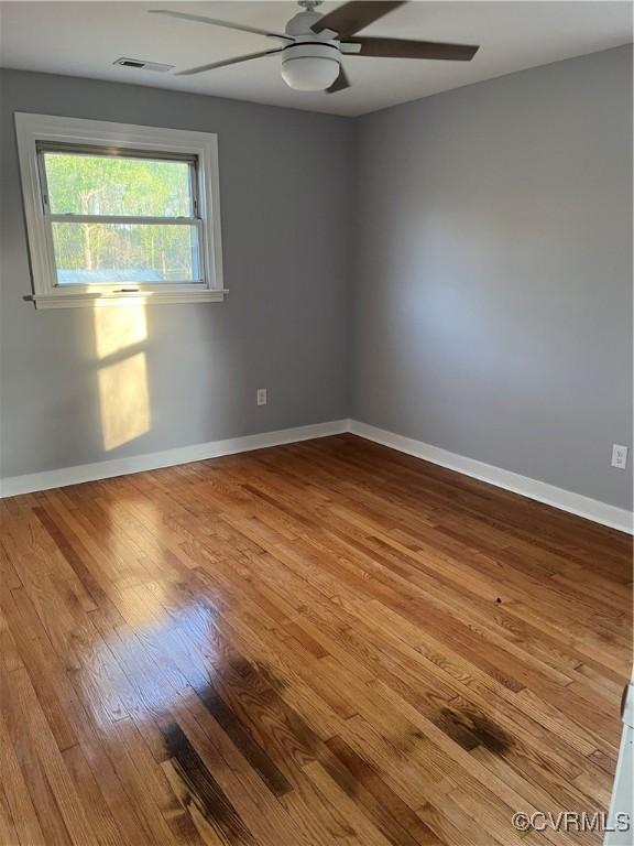 410 N Daisy Ave, Henrico, VA 23075 - empty room with wood finished floors, a ceiling fan, and baseboards