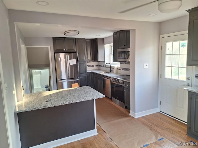 410 N Daisy Ave, Henrico, VA 23075 - kitchen with appliances with stainless steel finishes, a sink, light stone countertops, light wood-type flooring, and recessed lighting