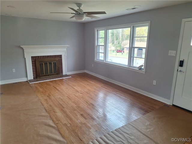 410 N Daisy Ave, Henrico, VA 23075 - unfurnished living room featuring ceiling fan, light wood-style flooring, and baseboards