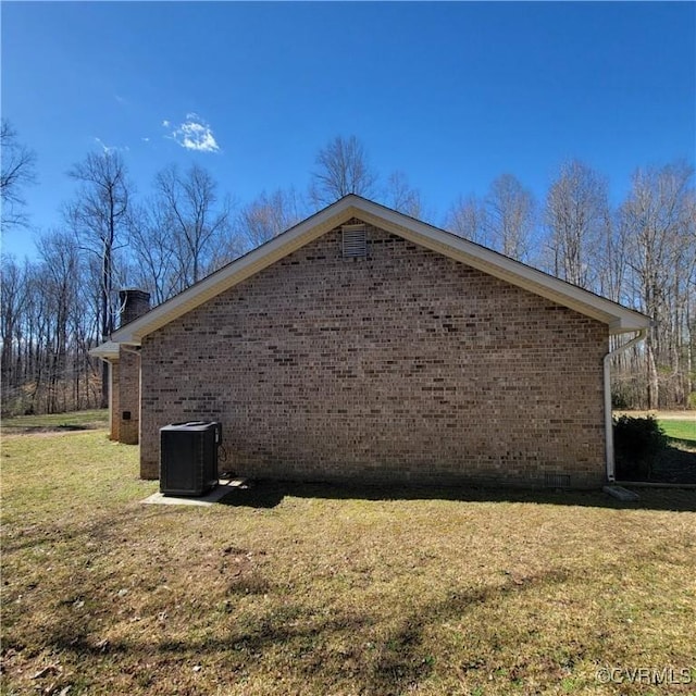 19164 Woodsons Mill Rd, Beaverdam, VA 23015 - view of home's exterior with central air condition unit, a lawn, crawl space, brick siding, and a chimney