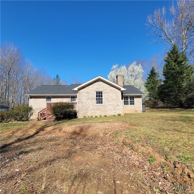19164 Woodsons Mill Rd, Beaverdam, VA 23015 - back of property with a chimney, brick siding, and a yard