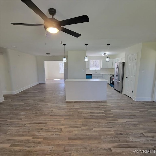 19164 Woodsons Mill Rd, Beaverdam, VA 23015 - kitchen featuring white cabinets, a ceiling fan, a sink, open floor plan, and freestanding refrigerator