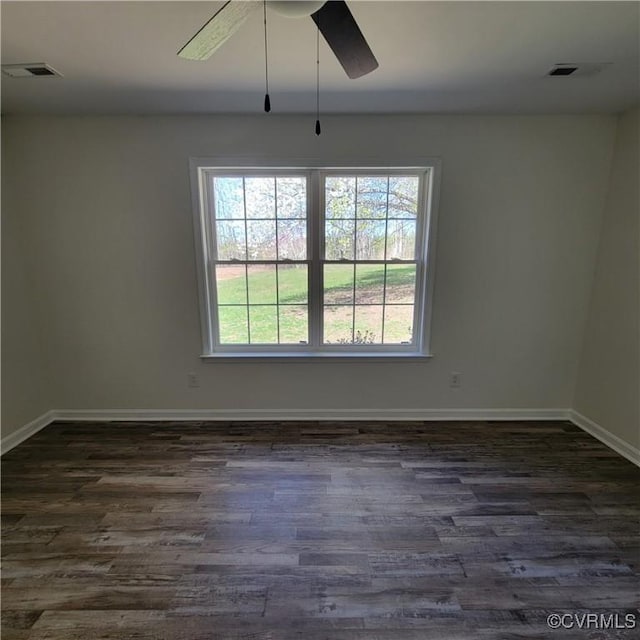 19164 Woodsons Mill Rd, Beaverdam, VA 23015 - unfurnished room featuring a ceiling fan, dark wood finished floors, baseboards, and visible vents