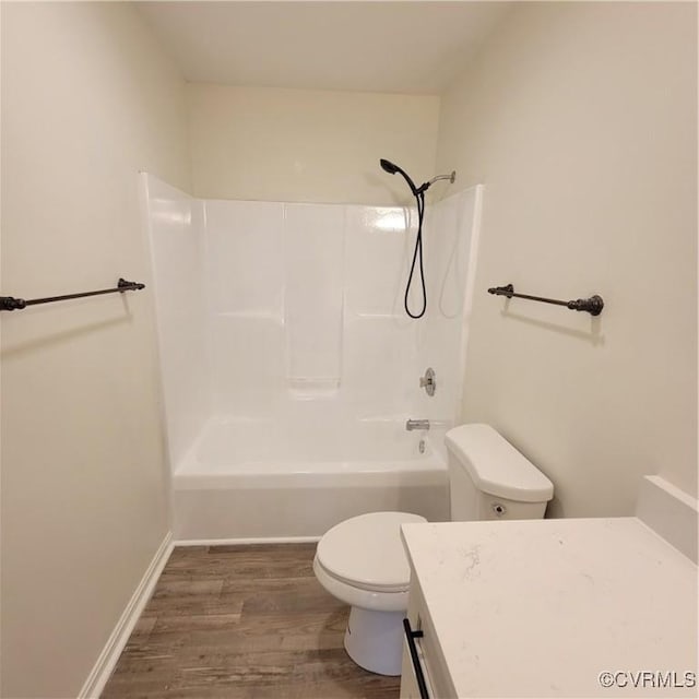 19164 Woodsons Mill Rd, Beaverdam, VA 23015 - full bathroom with shower / bathing tub combination, vanity, toilet, baseboards, and wood finished floors