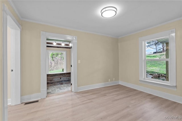 1413 First Rock Rd, Prospect, VA 23960 - spare room featuring visible vents, ornamental molding, wood finished floors, and a healthy amount of sunlight