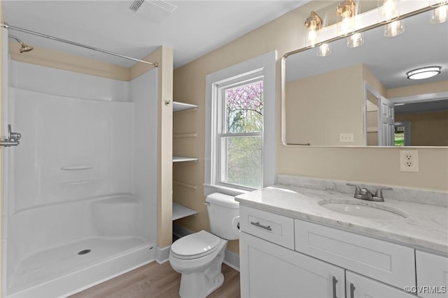 1413 First Rock Rd, Prospect, VA 23960 - full bath featuring vanity, wood finished floors, toilet, and a shower stall