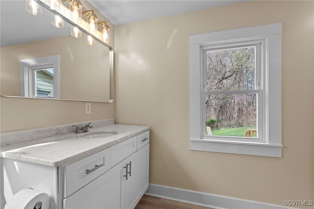 1413 First Rock Rd, Prospect, VA 23960 - bathroom with baseboards, wood finished floors, and vanity