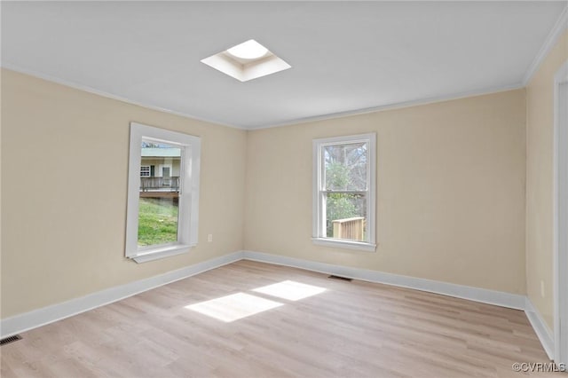 1413 First Rock Rd, Prospect, VA 23960 - spare room with a skylight, ornamental molding, light wood-type flooring, and visible vents