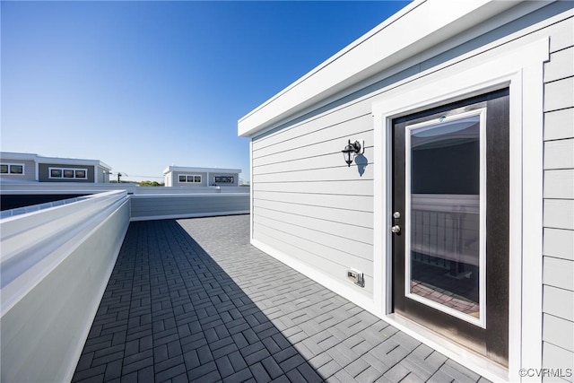 view of patio with a balcony