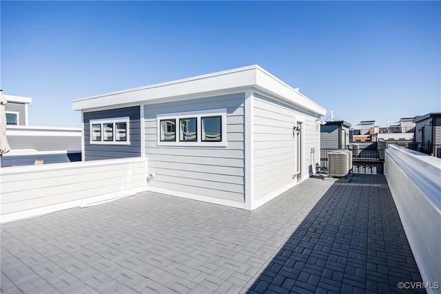 exterior space featuring a patio and central AC