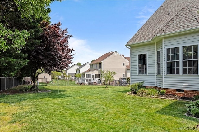 view of yard with fence and a residential view