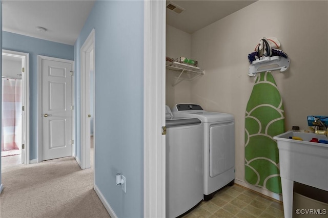10011 Loblolly Ter, Amelia, VA 23002 - laundry room with separate washer and dryer, baseboards, and light carpet