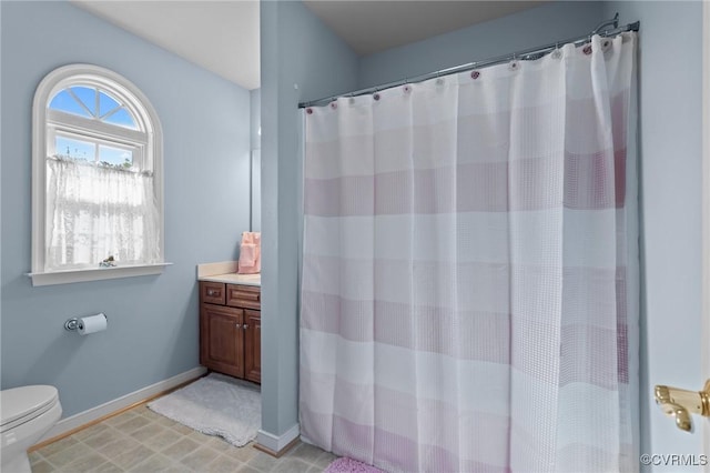 10011 Loblolly Ter, Amelia, VA 23002 - full bath with toilet, vanity, baseboards, and curtained shower