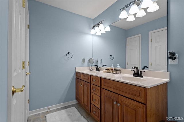 10011 Loblolly Ter, Amelia, VA 23002 - full bathroom with a chandelier, double vanity, and baseboards