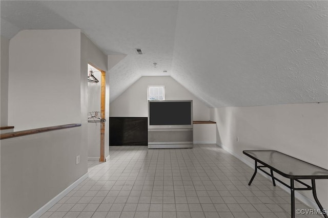 10011 Loblolly Ter, Amelia, VA 23002 - bonus room featuring a textured ceiling, vaulted ceiling, and baseboards