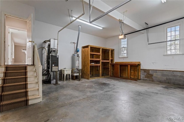 11421 Regal Ter, Providence Forge, VA 23140 - garage featuring a garage door opener and gas water heater