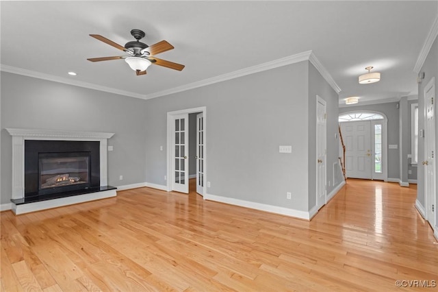 11421 Regal Ter, Providence Forge, VA 23140 - unfurnished living room featuring light wood-type flooring, crown molding, a ceiling fan, and baseboards