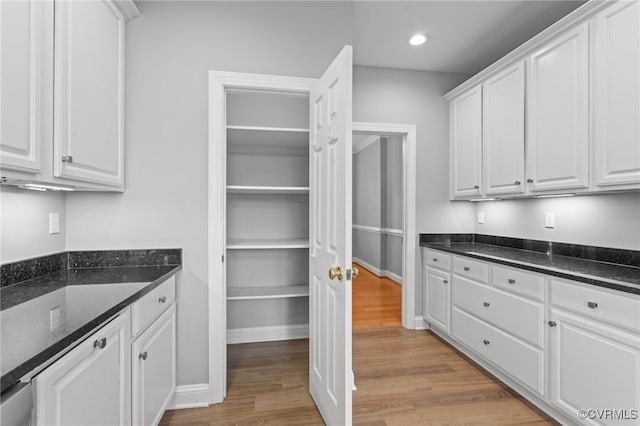 11421 Regal Ter, Providence Forge, VA 23140 - kitchen featuring white cabinetry, light wood-type flooring, dark stone countertops, and recessed lighting