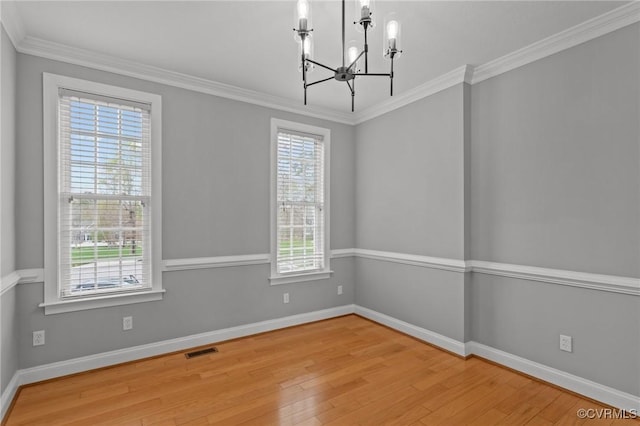 11421 Regal Ter, Providence Forge, VA 23140 - unfurnished room with wood finished floors, a chandelier, baseboards, and ornamental molding