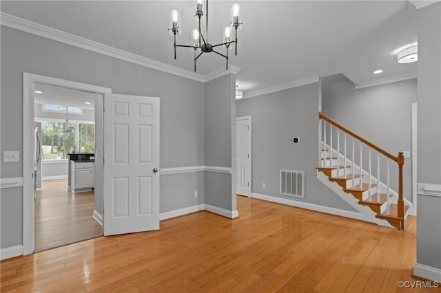 11421 Regal Ter, Providence Forge, VA 23140 - unfurnished dining area featuring light wood-style floors, ornamental molding, stairway, a chandelier, and baseboards
