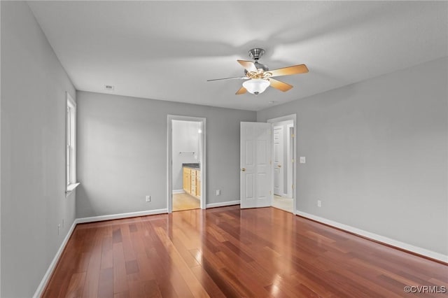 11421 Regal Ter, Providence Forge, VA 23140 - unfurnished bedroom featuring baseboards, wood finished floors, ensuite bath, and a ceiling fan