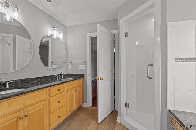 11421 Regal Ter, Providence Forge, VA 23140 - full bathroom with wood finished floors, a stall shower, and double vanity