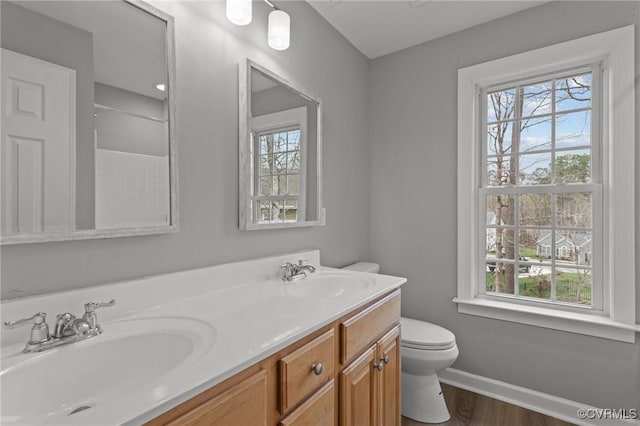 11421 Regal Ter, Providence Forge, VA 23140 - bathroom with toilet, double vanity, wood finished floors, and baseboards
