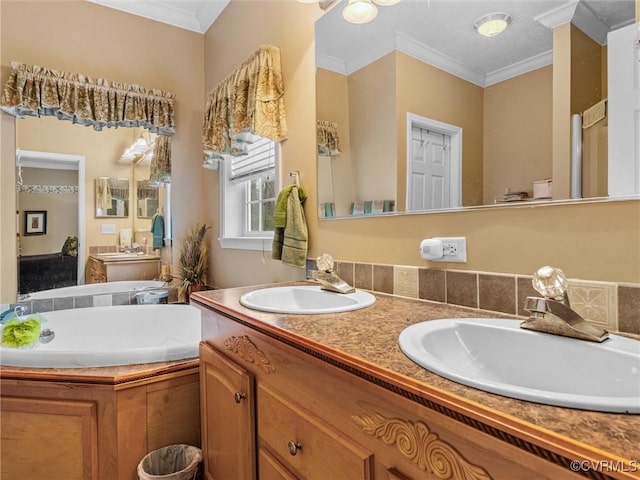 bathroom with a bath, double vanity, a sink, and crown molding