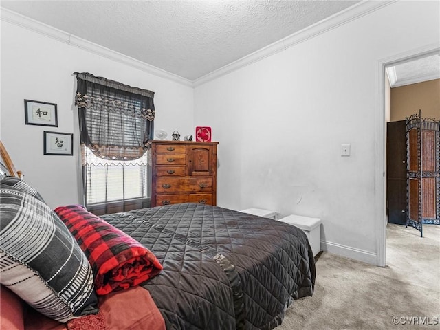 carpeted bedroom with baseboards, a textured ceiling, and crown molding
