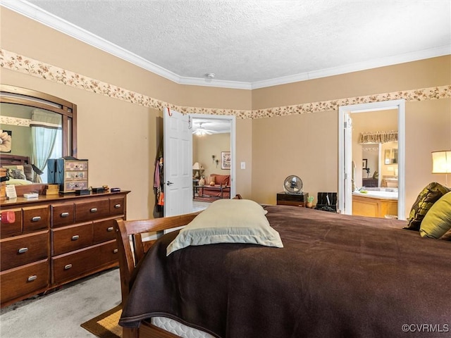 bedroom with ensuite bath, a textured ceiling, ornamental molding, and light carpet