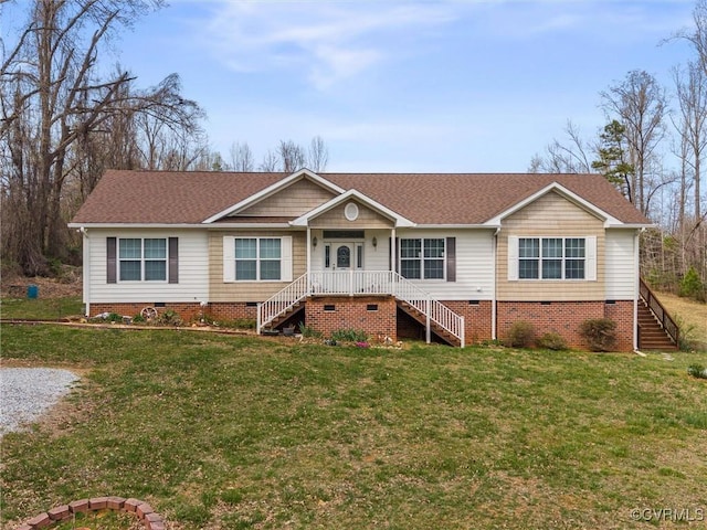 ranch-style house with stairs, crawl space, roof with shingles, and a front lawn