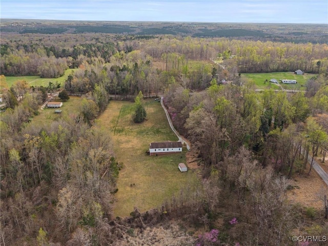 bird's eye view featuring a forest view