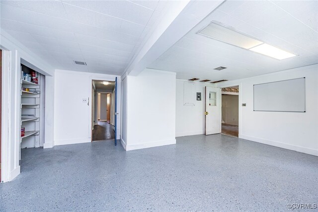 garage with visible vents and baseboards