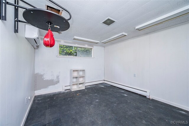 interior space featuring baseboard heating, an AC wall unit, concrete floors, baseboards, and a baseboard radiator