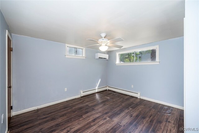 unfurnished room with a wall mounted air conditioner, a baseboard radiator, baseboard heating, dark wood-type flooring, and a ceiling fan