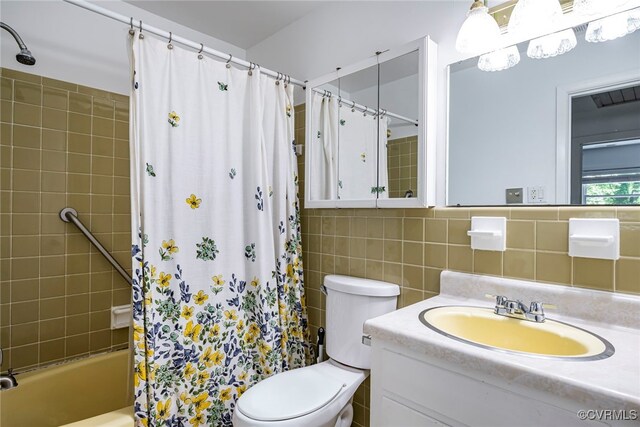 bathroom with vanity, toilet, tile walls, shower / bathtub combination with curtain, and backsplash